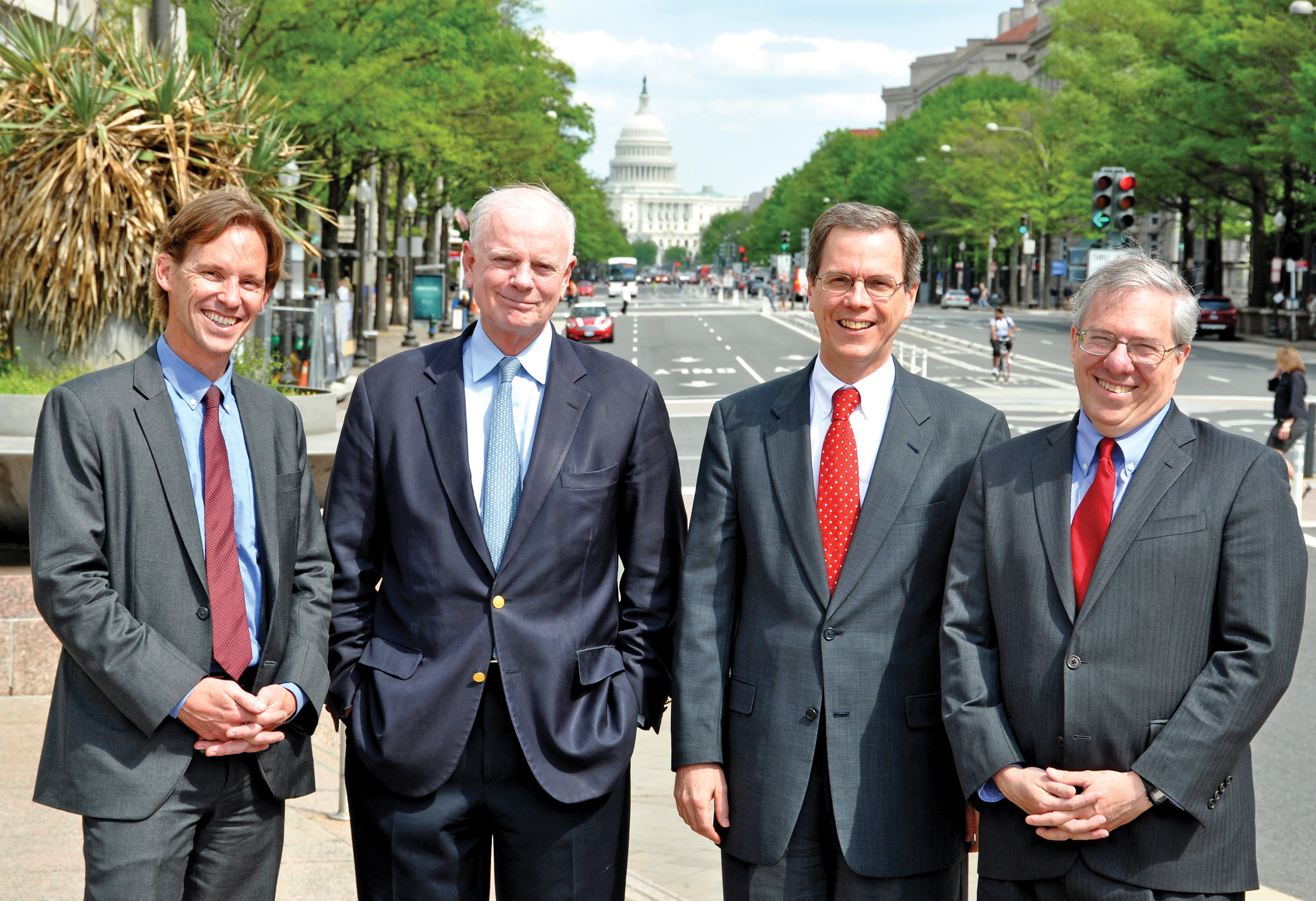 Four Wesleyan graduates collaborate on USAID’s  crucial water projects, just down the avenue from the White House: John Pasch ’93, Christian Holmes ’68, Charles North ’82, and Eric Postel ’77.