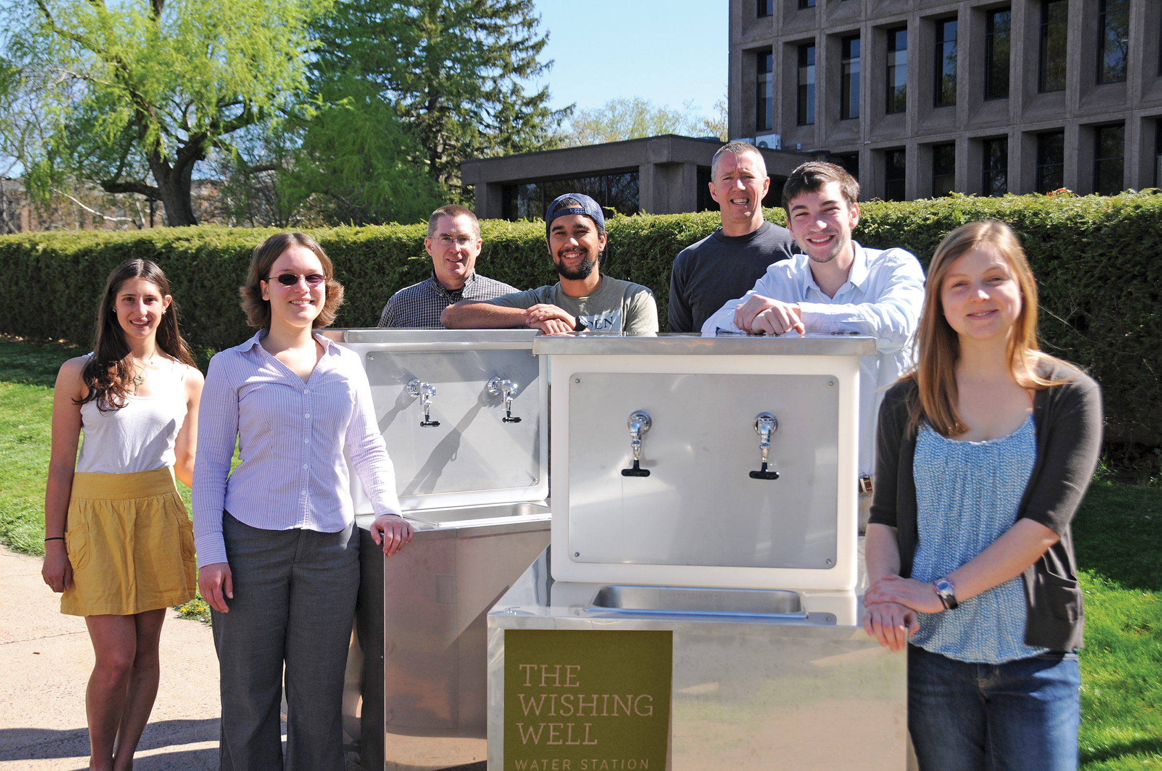 From left, Nina Gerona ’15; Jen Kleindienst, sustainability coordinator; Bruce Strickland, instrument maker specialist; Tavo True-Alcalá ’15; Dave Strickland, instrument maker specialist; Brent Packer ’15; and Madeleine O’Brien ’16 present the student-designed “Wishing Well.” Photo by Olivia Drake MALS ’08.