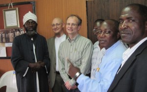 Tjip Walker ’79 (center) meets with Pastor James Wuye (right in blue shirt) and Imam Mohammed Ishafa (far left), co-founders of the Interfaith Mediation Center, Kaduna, Nigeria, a leading peacebuilding organization in Northern Nigeria and a recipient of USAID/OTI grants. “Incidentally the Pastor and Imam have emerged as two of Nigeria's most influential peacebuilders,” writes Walker, “joining forces in 2000 after sectarian riots ripped through Kaduna.”