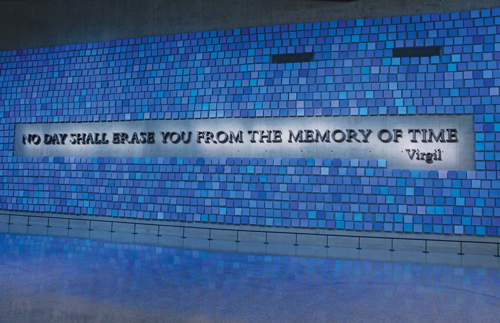 3. “No day shall erase you from the memory of time,” a quote from The Aeneid, by Virgil, forged by artist Tom Joyce from steel recovered from the World Trade Center, reflects the museum’s mission to honor and remember. Surrounding the Joyce work is an installation by artist Spencer Finch, “Trying to Remember the Color of the Sky on That September Morning,” which features 2,983 watercolor squares—each its own shade of blue, each representing a victim of the 2001 and 1993 attacks. Photo: Jin Lee/911 Memorial.