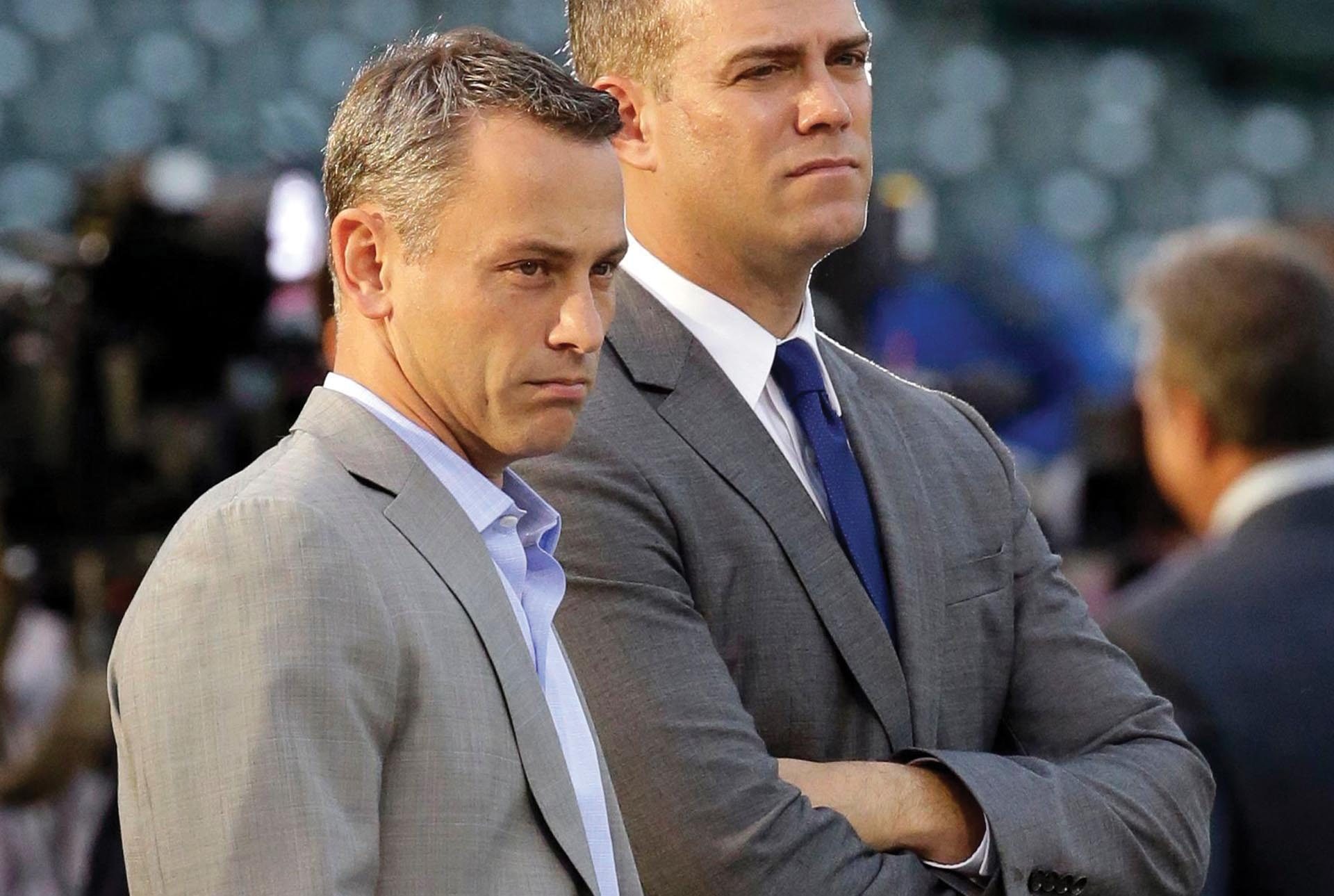 President Jed Hoyer of the Chicago Cubs presents a jersey to