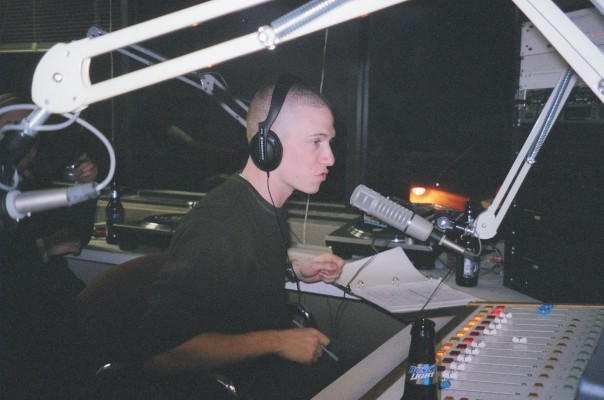 Jesse Sommer at the mic in the WESU studio as an undergrad